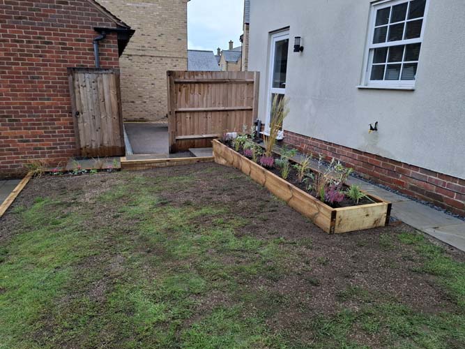 Rejuvenate sloping garden with new patio, terrace, borders and raised bed