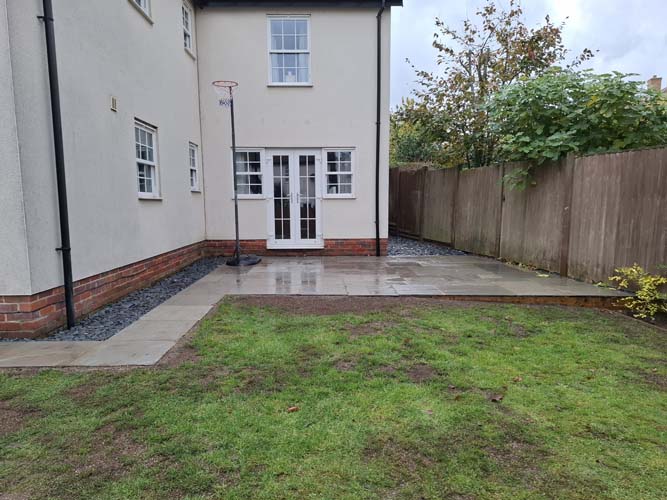 Rejuvenate sloping garden with new patio, terrace, borders and raised bed