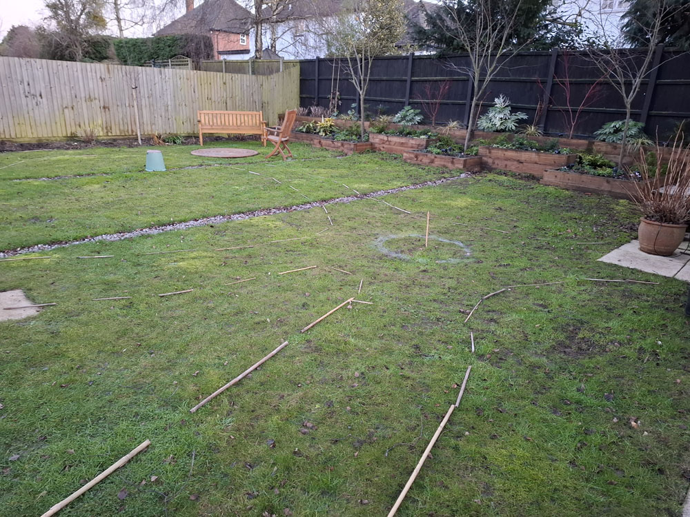 Large Makeover with winding slate paths and herbaceous borders