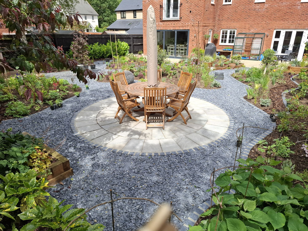 Large Makeover with winding slate paths and herbaceous borders
