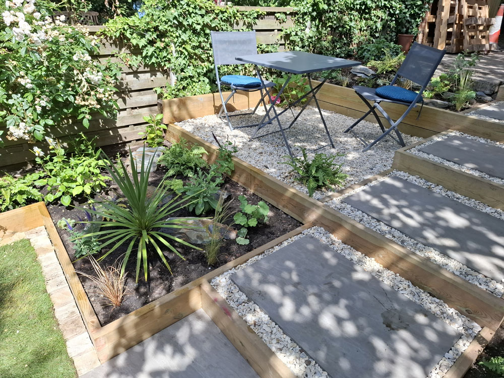 Narrow garden makeover with new patio, steps, raised beds and lawn