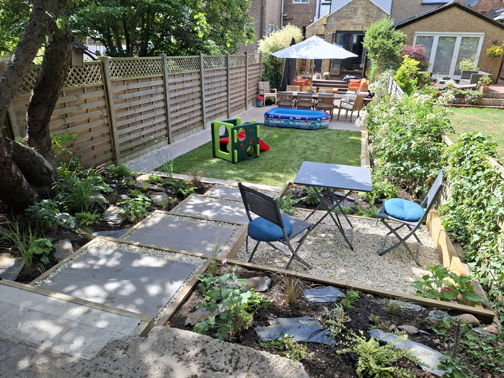 Narrow garden makeover with new patio, steps, raised beds and lawn