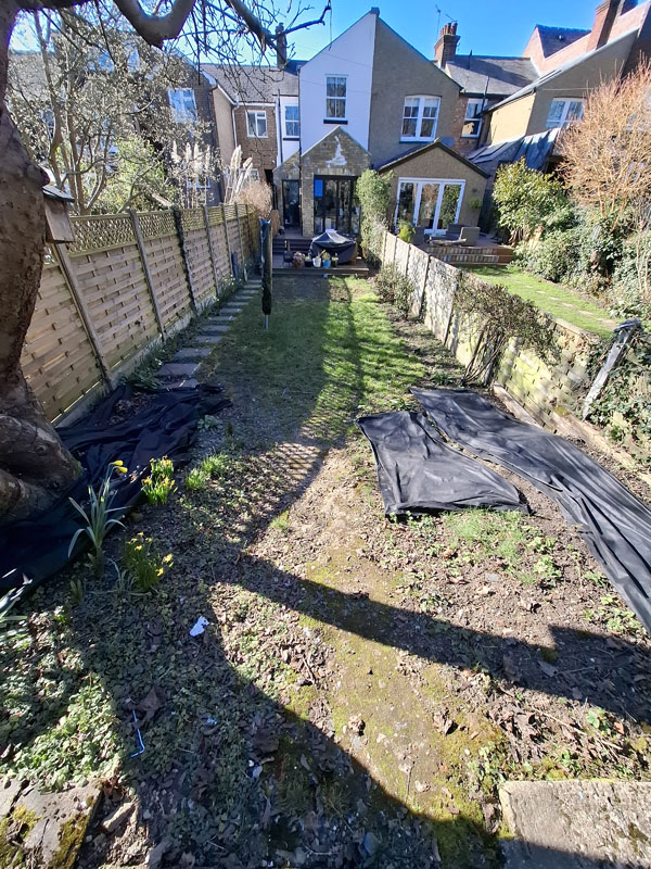 Narrow garden makeover with new patio, steps, raised beds and lawn