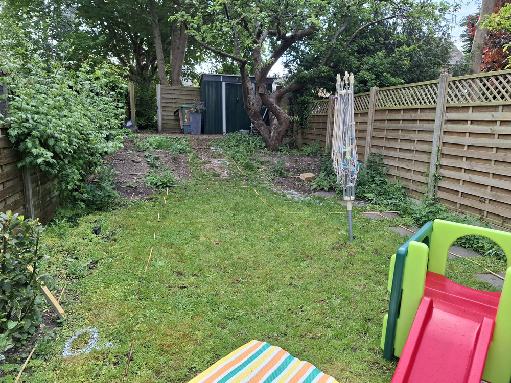 Narrow garden makeover with new patio, steps, raised beds and lawn