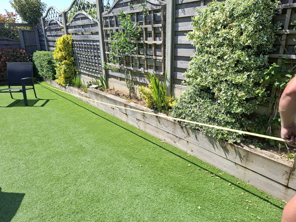 New brick retaining wall including raised bed