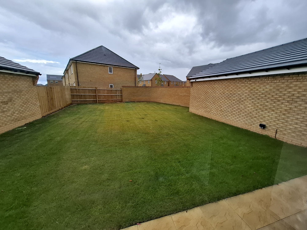 New build, simple concrete raised beds on perimeter