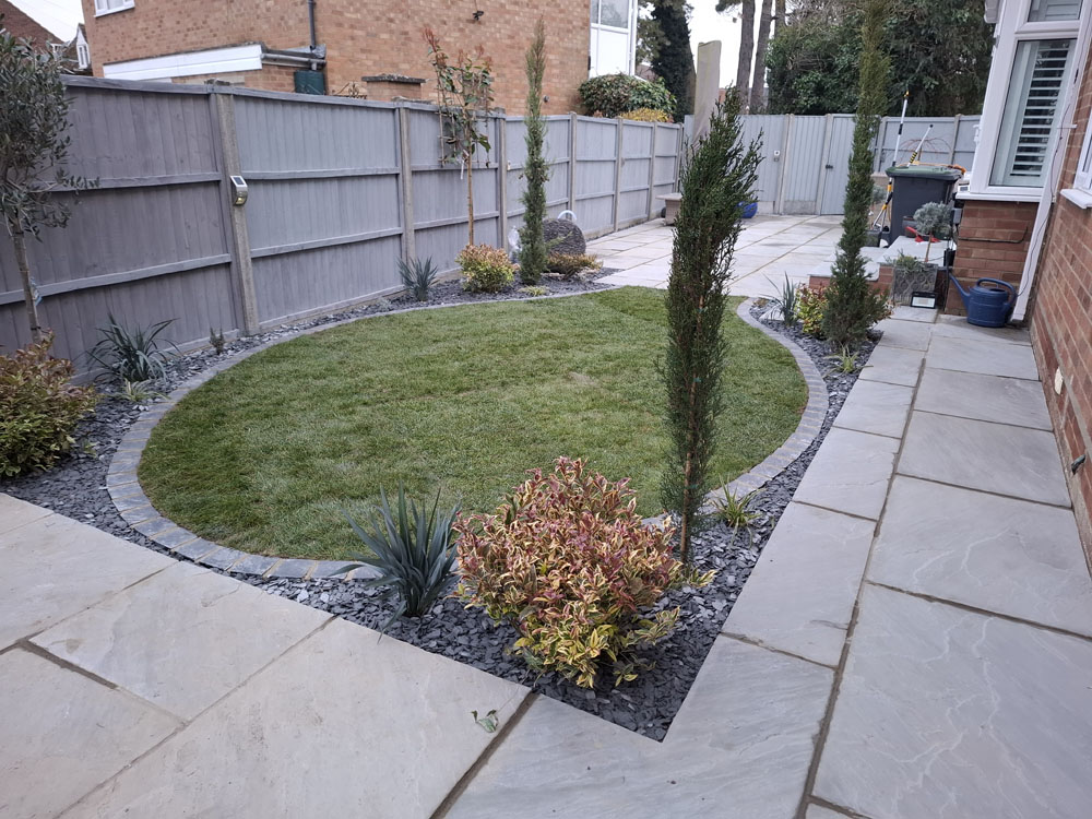 New patio, smaller artificial lawn, low maintenance