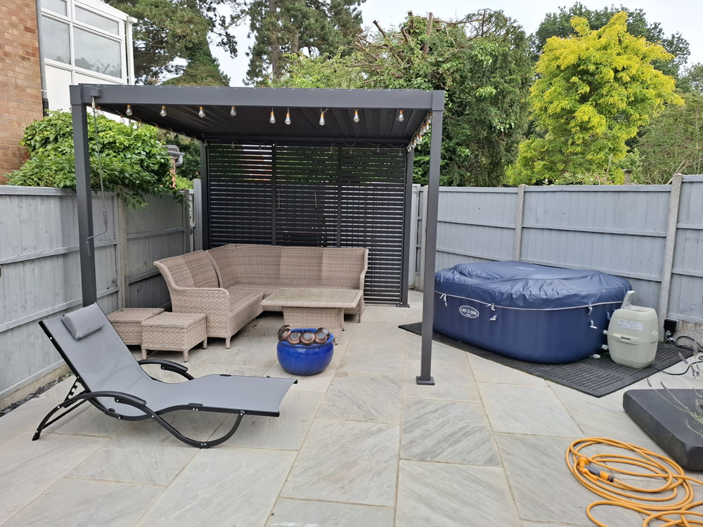 New patio, smaller artificial lawn, low maintenance