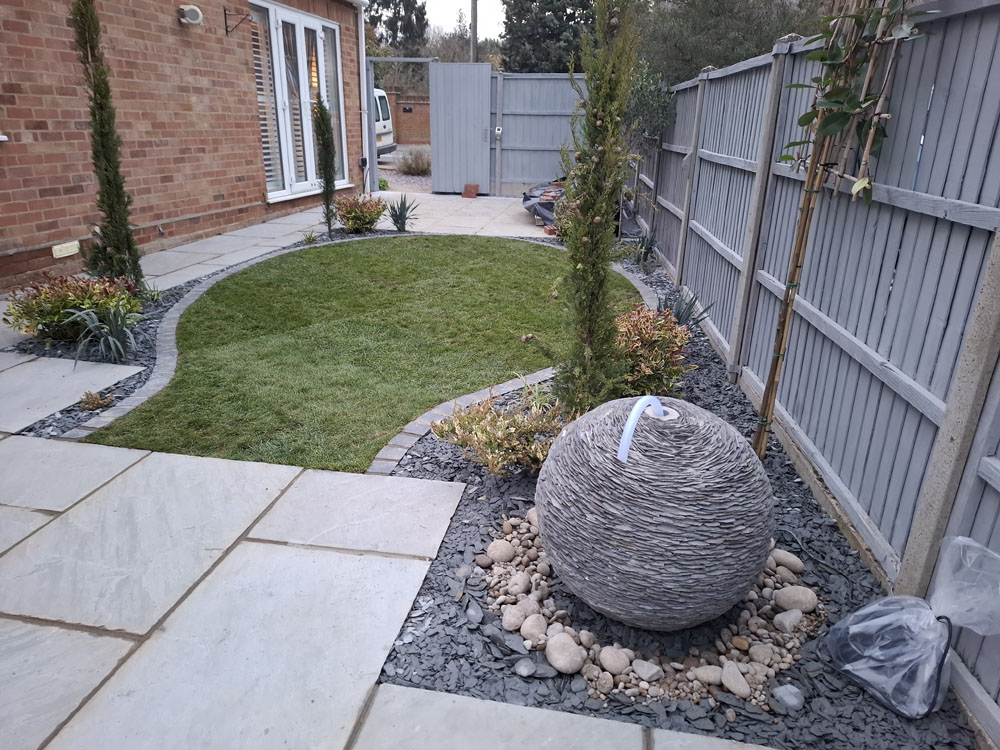 New patio, smaller artificial lawn, low maintenance